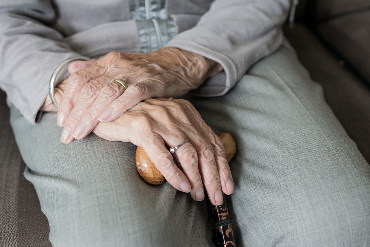 senior crossing their hands on their lap