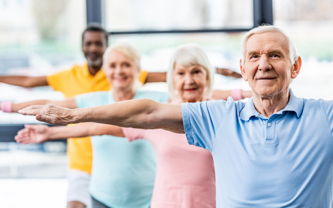 senior athletes synchronous doing exercise at gym